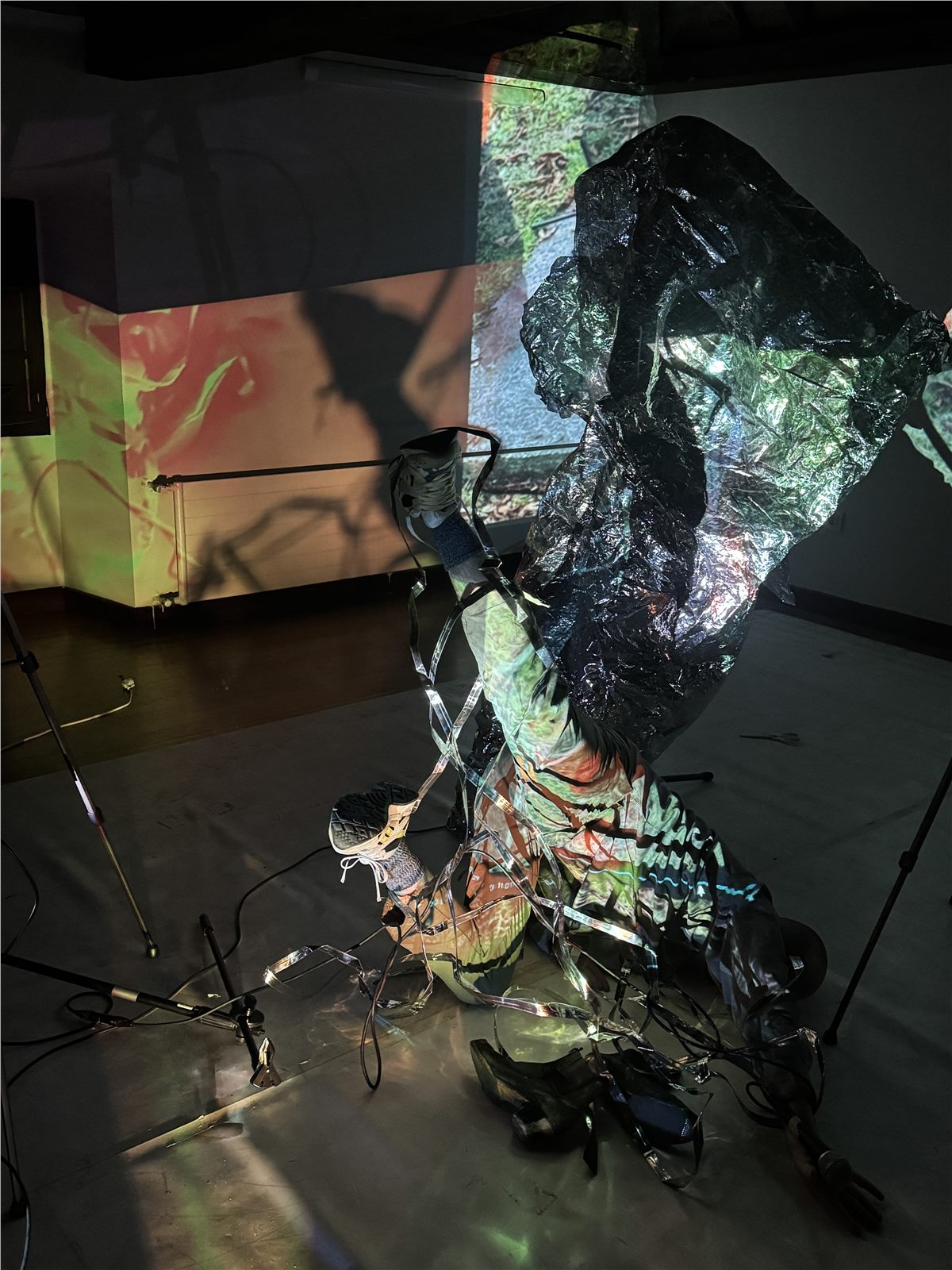 Body inside a dark projection installation